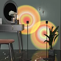 Modern Floor Lamp Projecting Colorful Light Circles in Bedroom Vanity Area with Green Plant