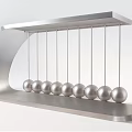 Decorative Ornament Set with Silver Metal Frame and Multiple Balls Newton's Cradle Design