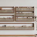 Wooden Wall Cabinets With Books Decorations And Baskets On Light Colored Wall Beside Green Plant