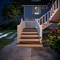 Staircase With Wooden Steps And White Railings In Nighttime Setting Near Rose Bushes Stone Pathway