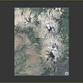 Satellite View Of Volcanic Mountain Terrain With Snow Capped Peaks And Green Vegetation