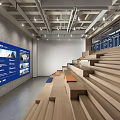 Modern Library Interior With Wooden Stepped Seating And Blue Display Screens