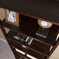 Dark Colored Multi Shelf Bookcase With Books Photo Frames Decorations And Vase