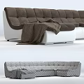 Modern Brown And White Sectional Sofa With Blanket In Stylish Living Room Design