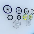 Colorful Bicycle Tires Purple Black Yellow Silver Arranged on Light Blue Background