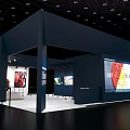 Sotheby's Exhibition Booth With Large Screen Displaying Artworks And Deep Blue Design