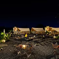 Outdoor Patio Night View With Wooden Tables Chairs Green Trees And String Lights