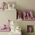 Elegant Jewelry Collection Display With Pastel Pink Stands And Mannequins