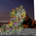Colorful Flower Display With Black Cone Decoration Against City Night Sky Background
