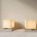 Square Table Lamps With Light Colored Shades And Textured Bases On Table