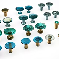 Various Decorative Cabinet Handles In Blue Green And Gold With Metallic Glass Designs
