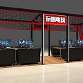 Indoor Amusement Park Arcade With Multiple Screens Black Sofas Red Signs And Metal Framework