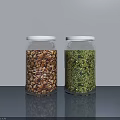 Two Glass Spice Jars With White Lids Filled With Brown And Green Spices