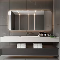 Modern Bathroom Mirror With Surrounding Lighting Gray Walls White Vanity And Toiletries