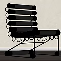 Modern Black Leisure Chair With Metal Frame Cylindrical Cushions And Circular Ring Details