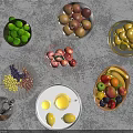 Colorful Ceramic Vessels Holding Various Fresh Fruits on Grey Countertop