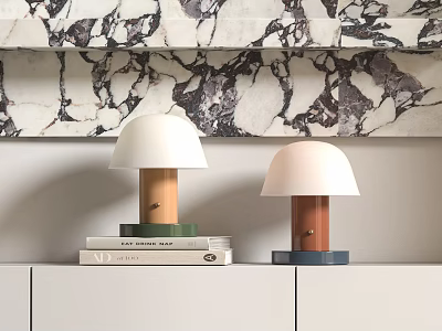 Two Modern Table Lamps On White Cabinet With Marble Wall And Stacked Books 3d model