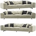 Modern Beige Upholstered Sectional Sofa With Dark Accent Pillows And Metal Legs