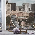 Wooden Slat Lounge Chair by Window with City Skyline View and Decorative Shell Ornament