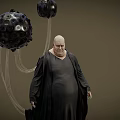 Bald Obese Game Movie Character In Black Robe With Hanging Black Spherical Objects