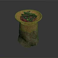 Stone Pedestal With Brass Bowl Filled With Black Charcoal Pieces And Ornate Gold Carvings On Base