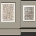 Textured Decorative Paintings Hanging On Light Colored Wall With Wooden Countertop