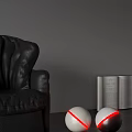 White Spherical Decorative Lights With Red Rings Near Black Leather Chair And Open Book