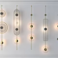 Modern Wall Lamps With Geometric Shapes And Golden Metal Frames Lit On White Wall