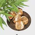 Delicious Bread and Walnuts on Wooden Tray with Green Plants Black Vase and Gray Cloth
