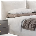 Modern Upholstered Double Bed With White Sheets Gray Blanket Plush Pillows And Nightstand