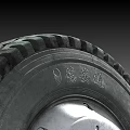 Heavy Duty Tire With Black Rubber Construction And Metal Rim Tread Pattern