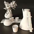 Modern Tea Set with Teapot Teacups and Decorative Tray alongside Vase with Yellow Leaves