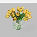 Yellow Tulips In Transparent Glass Vase With Green Stems And Water