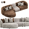 Light Gray And Brown Curved Sectional Sofa With Plush Pillows And Striped Blanket Design