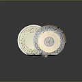 Yellow Diamond Shaped Sweet Treats In Ornate Bowl With Decorative Patterned Plates