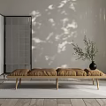 Modern Brown Sofa Bench With Wooden Legs Black Vase Plant Room Divider And Shadow Wall