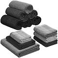 Assorted Colored Soft Cotton Towels Hanging And Folded In Bathroom