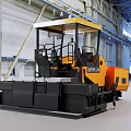 Caterpillar Yellow Industrial Paver With Cab And Tracks In Indoor Factory Setting
