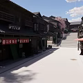 Traditional Japanese Commercial Street With Historic Buildings Cherry Blossom Trees And Stone Pavement