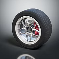 Sporty Tire Featuring Silver Alloy Wheel Red Brake Caliper And Aggressive Tread Pattern 3d model