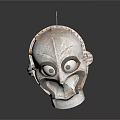 Traditional Cultural Mask With White Surface Black Accents And Large Eyes