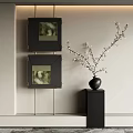 Stylish Interior With Black Framed Artworks And White Flowering Vase On Pedestal