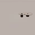 Light Colored Round Side Tables With Brown Ribbed Legs And Black Hole Design