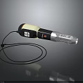 Handheld Electronic Appliance With Black White Orange Design Display Screen Control Buttons And Lanyard Cable