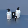 Daily Skincare Necessities With White Bottles Black Pumps Small Black Containers