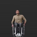 Man in Wheelchair Wearing Khaki Shirt and Jeans Against Black Background
