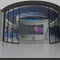 Modern Technology Exhibition Space With Circular Platform Blue Lighting And Digital Screens