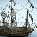 Classic Wooden Sailing Ship With Multiple Sails And Intricate Hull Details