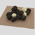 Black and White Decorative Round Balls Arranged on Brown Textured Linen Cloth
