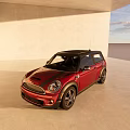 Red Five Door Compact Car With Black Roof And Alloy Wheels In Gray Indoor Showroom